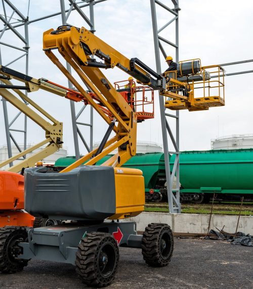 Lift with platform work in warehouse hangar construction field.