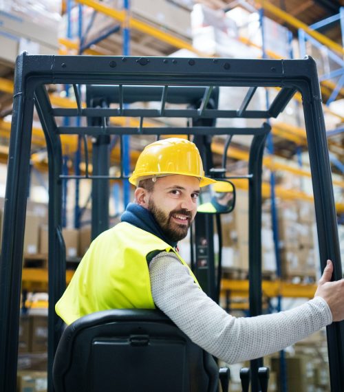 Warehouse man worker with forklift.